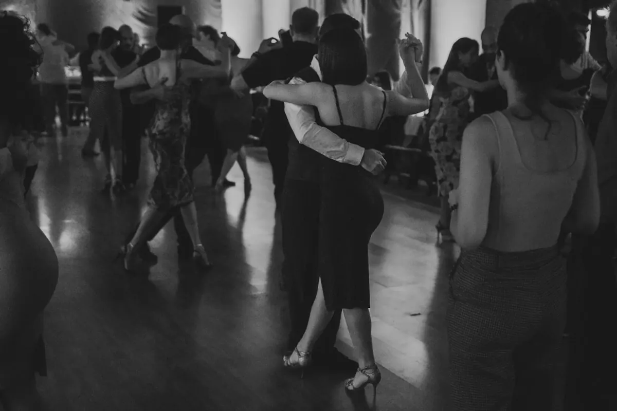 Couples dancing together on a ballroom floor at a Dance Spectacular social